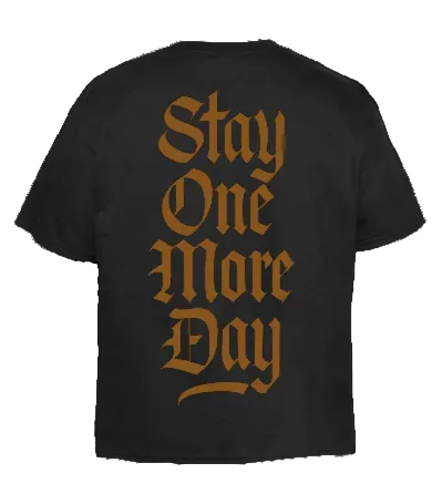 Black t-shirt with 'Stay One More Day' text in gold on a white background